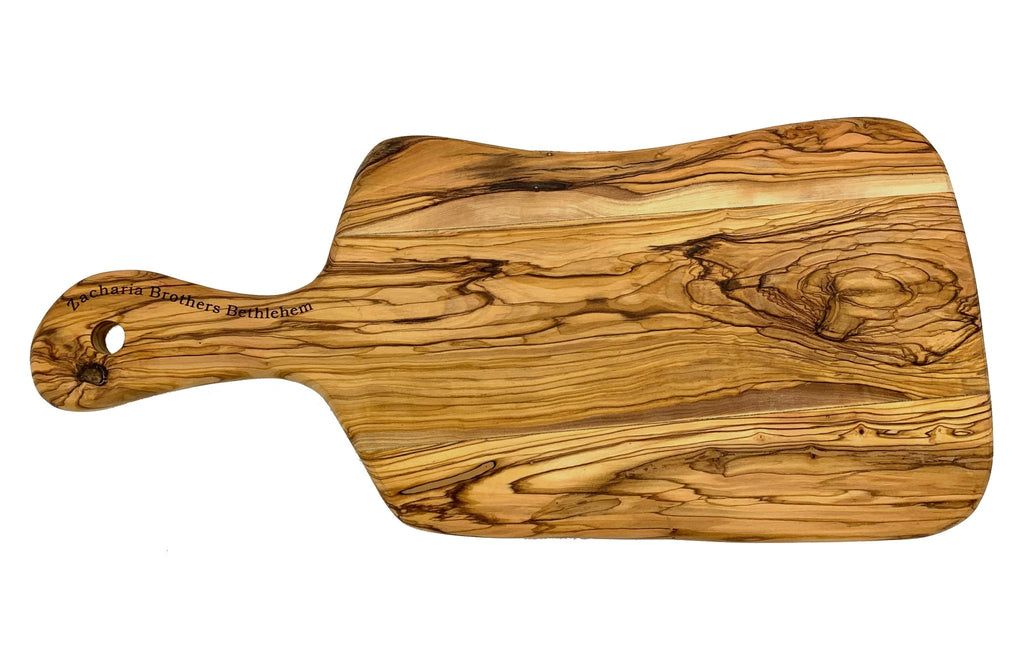 http://www.shenandoahhomesteadsupply.com/cdn/shop/products/olive-wood-paddle-handle-cutting-boards-including-oil-made-in-bethlehem-746889_1024x1024.jpg?v=1697819137